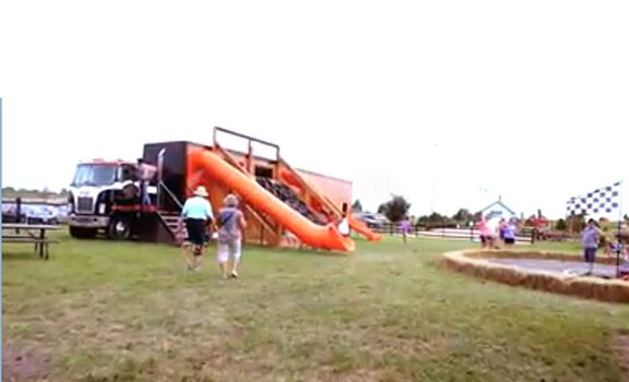 10 Ft Straight Plastic Tube Slide – Trailer-Mounted Playhouse Installation – Portable Event Setup